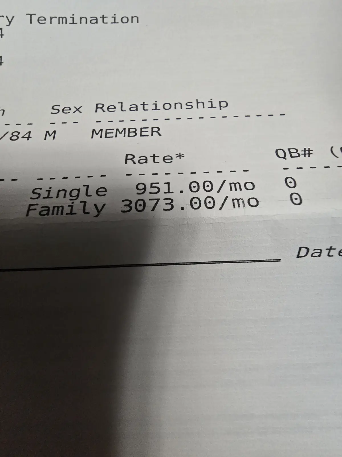 A close-up of a printed form showing insurance rates, where 'Single' is listed at $951.00/month and 'Family' at…