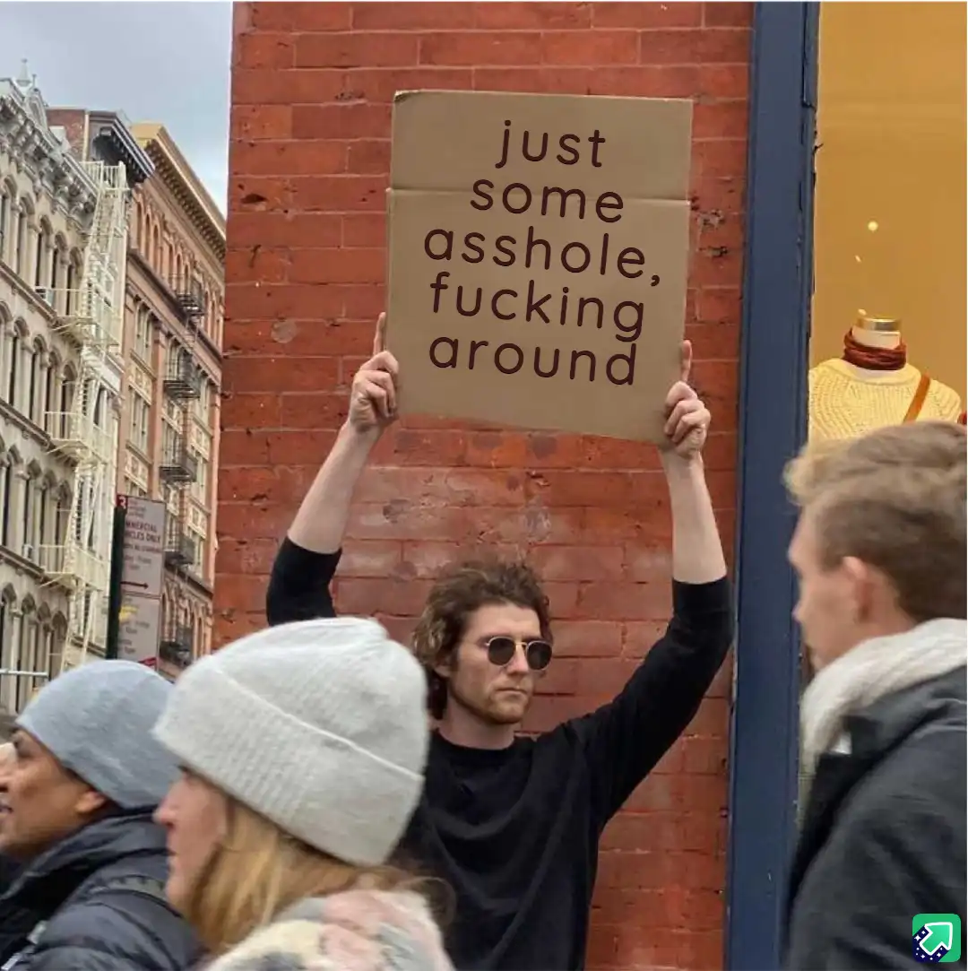A man with curly hair and sunglasses holds up a cardboard sign with the text 'just some asshole, fucking around' while…
