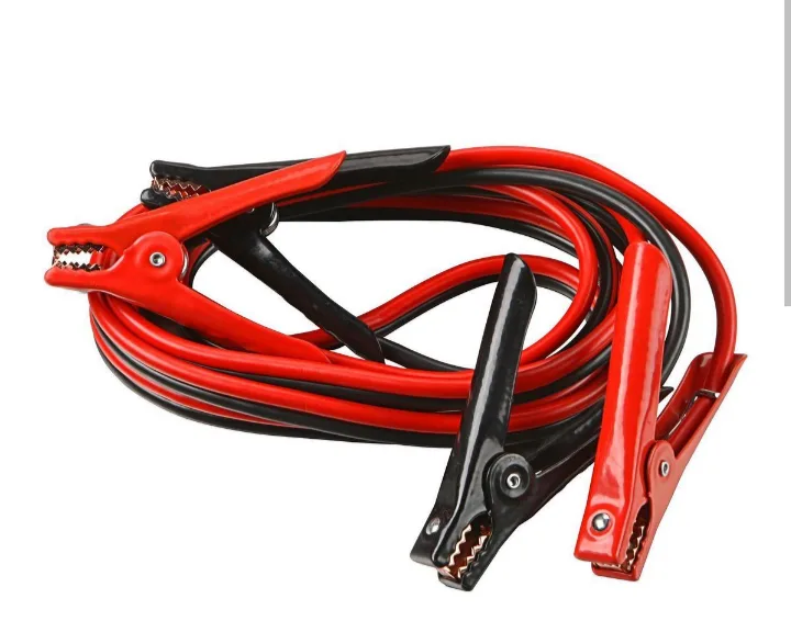 A coiled set of red and black jumper cables with metal alligator clips against a white background. The overlaid text reads…